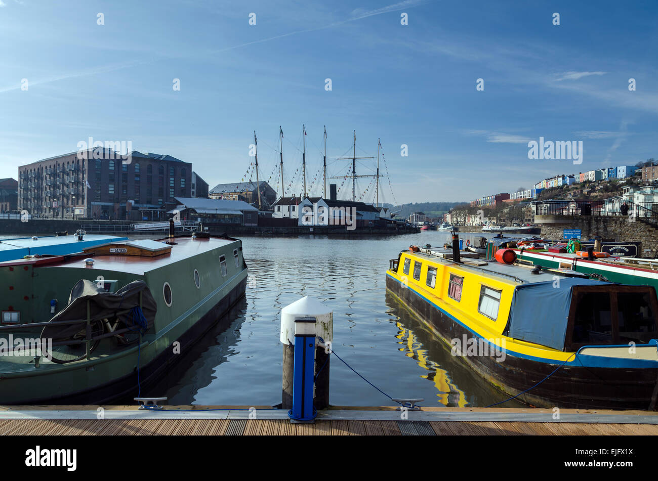 Houseboats on Bristol's harbourside with a view across the water to the