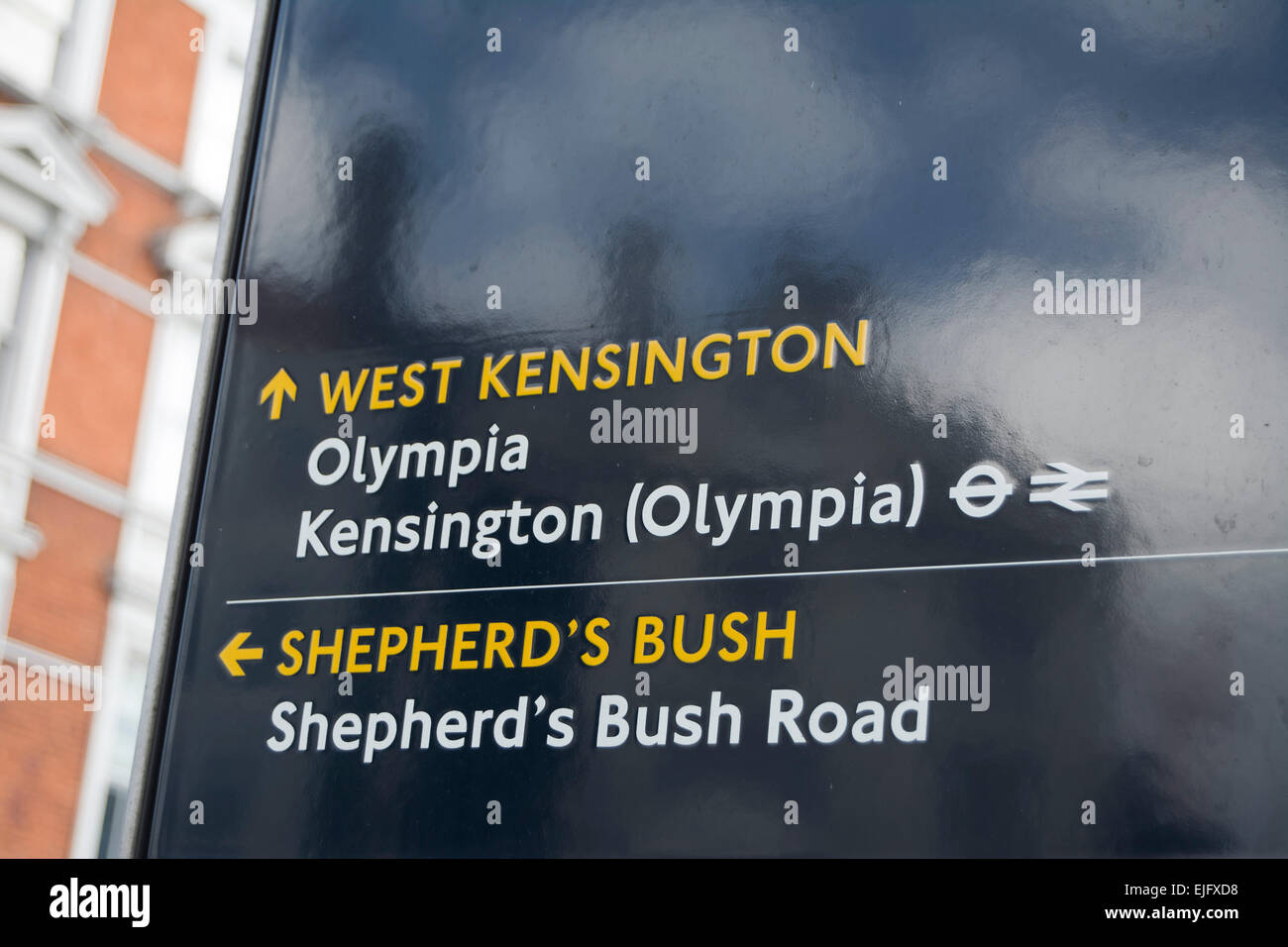 directions sign in hammersmith, london, england, with directions for west kensington, olympia
