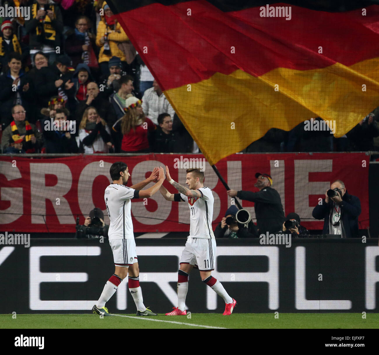 Kaiserslautern, Germany. 25th Mar, 2015. Germany's Marco Reus (R) and Sami Khedira cheer after scoring the 1-0 goal during the international friendly Germany vs Australia in Kaiserslautern, Germany, 25 March 2015. Photo: Thomas Frey/dpa/Alamy Live News Stock Photo