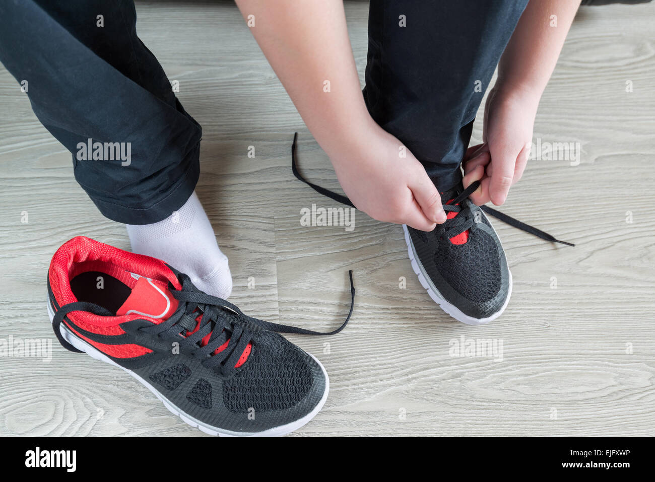 The boy running shoes laces Stock Photo Alamy