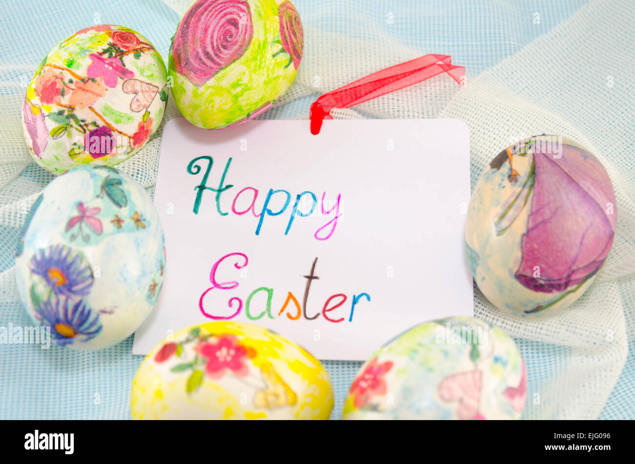 Bunch of handcolored decoupage Easter eggs around a handwritten ...
