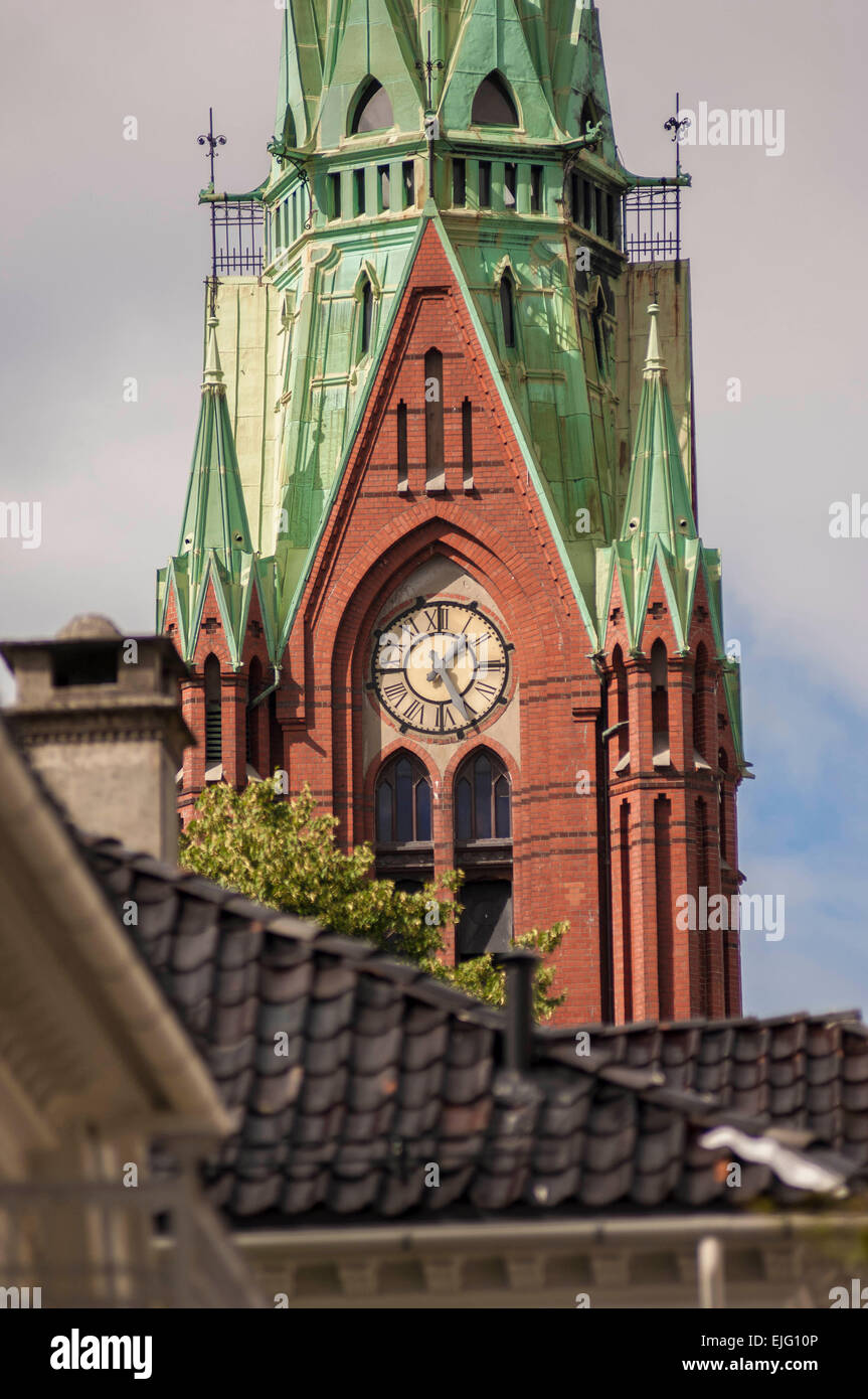 Close shot of clock on tower of Johanneskirken church in Bergen, Norway Stock Photo