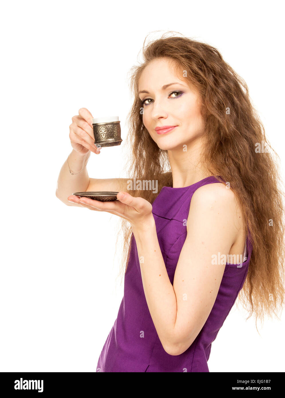 Young happy woman holding a coffee cup isolated on white background ...