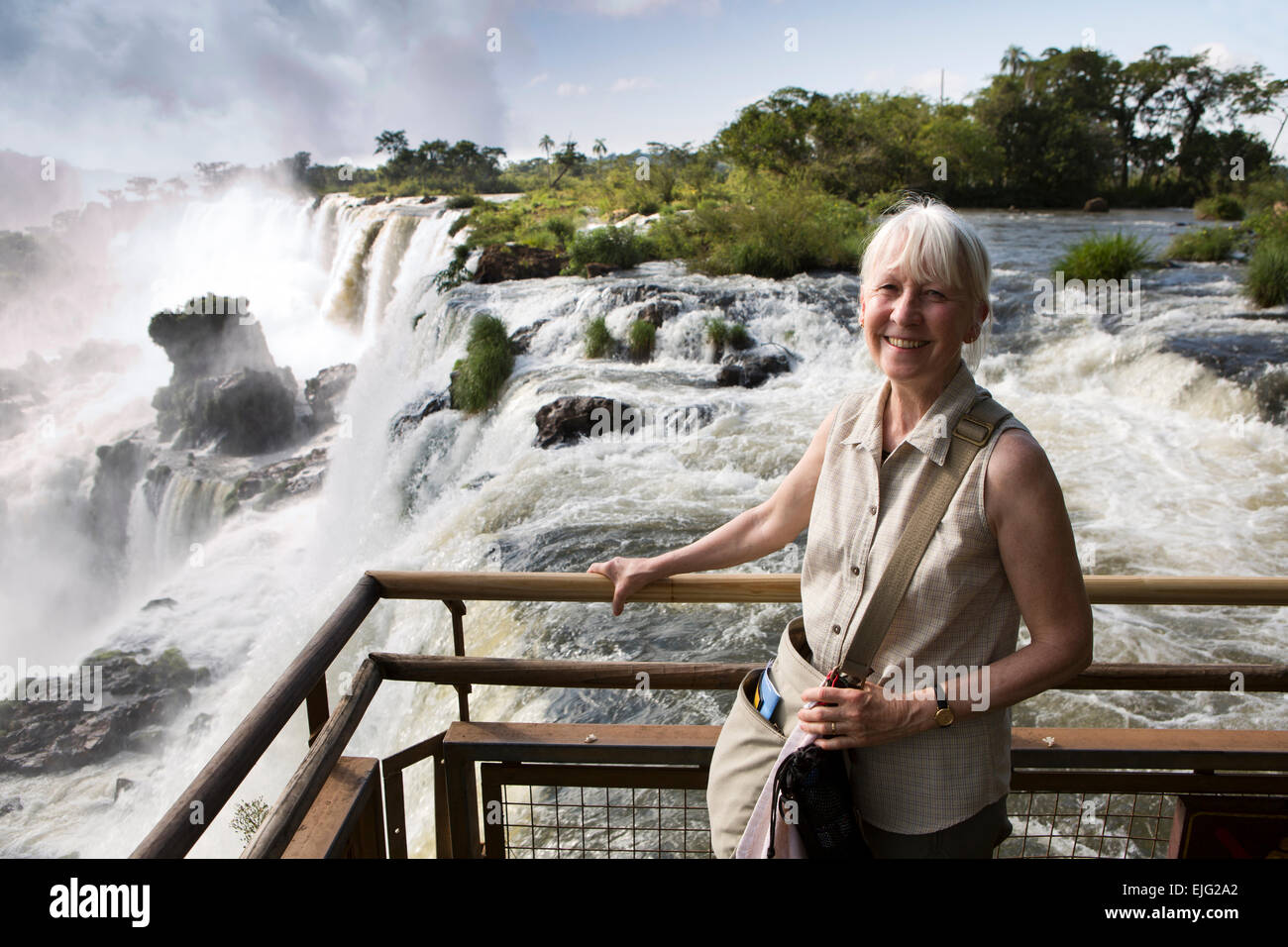 Argentina, Iguazu Falls, female tourist at San Martin, Mbigua and Bernabe Mendez waterfalls Stock Photo