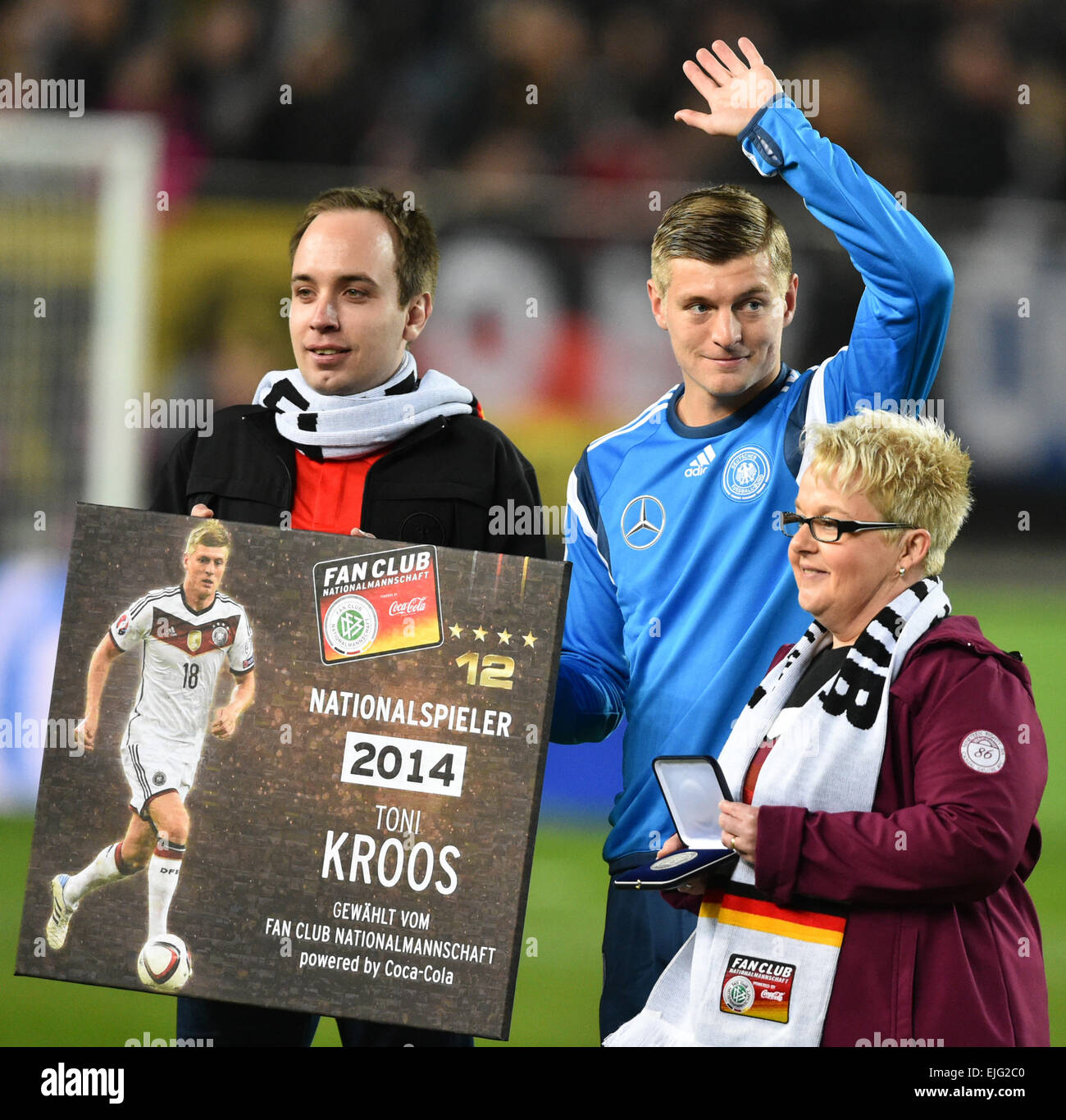 Representatives of Team Germany's soccer fan club present Germany's