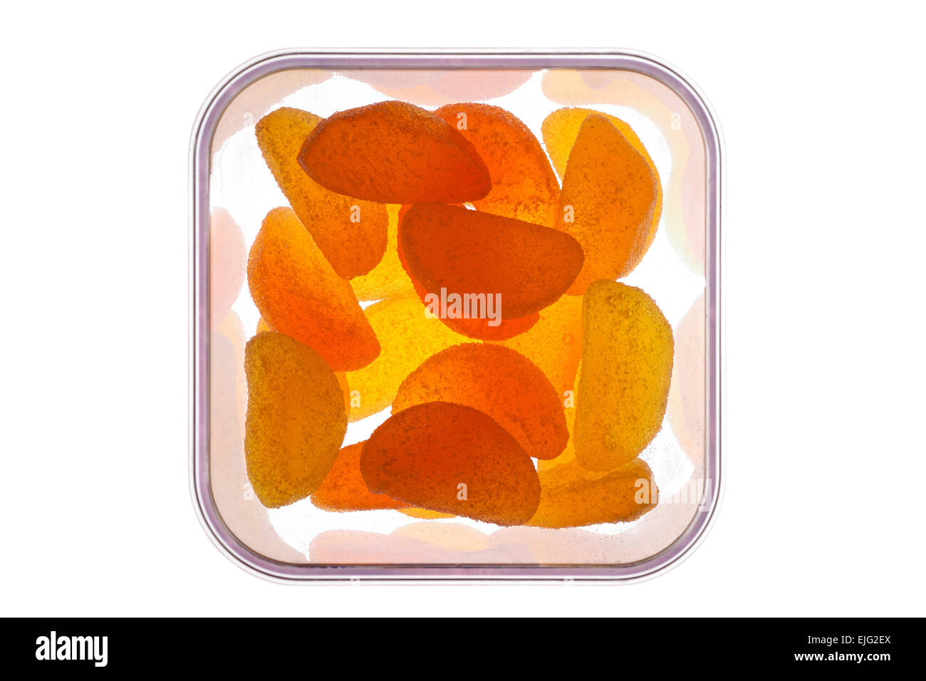 Orange and lemon jellies in glass jar backlit  close-up Stock Photo