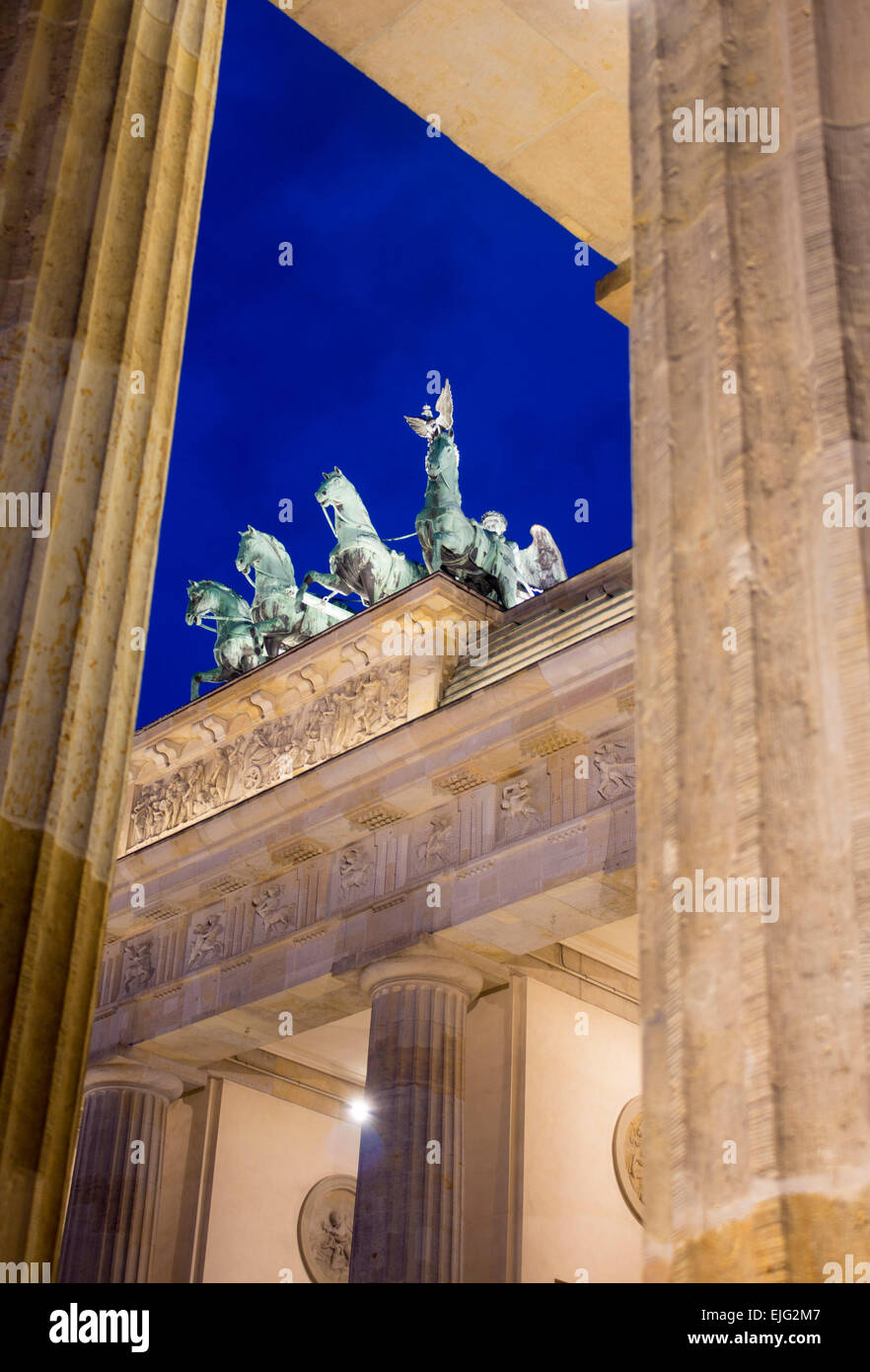 Brandenburg Gate Brandenburger Tor view through pillars at night dusk twilight Mitte Berlin Germany Stock Photo