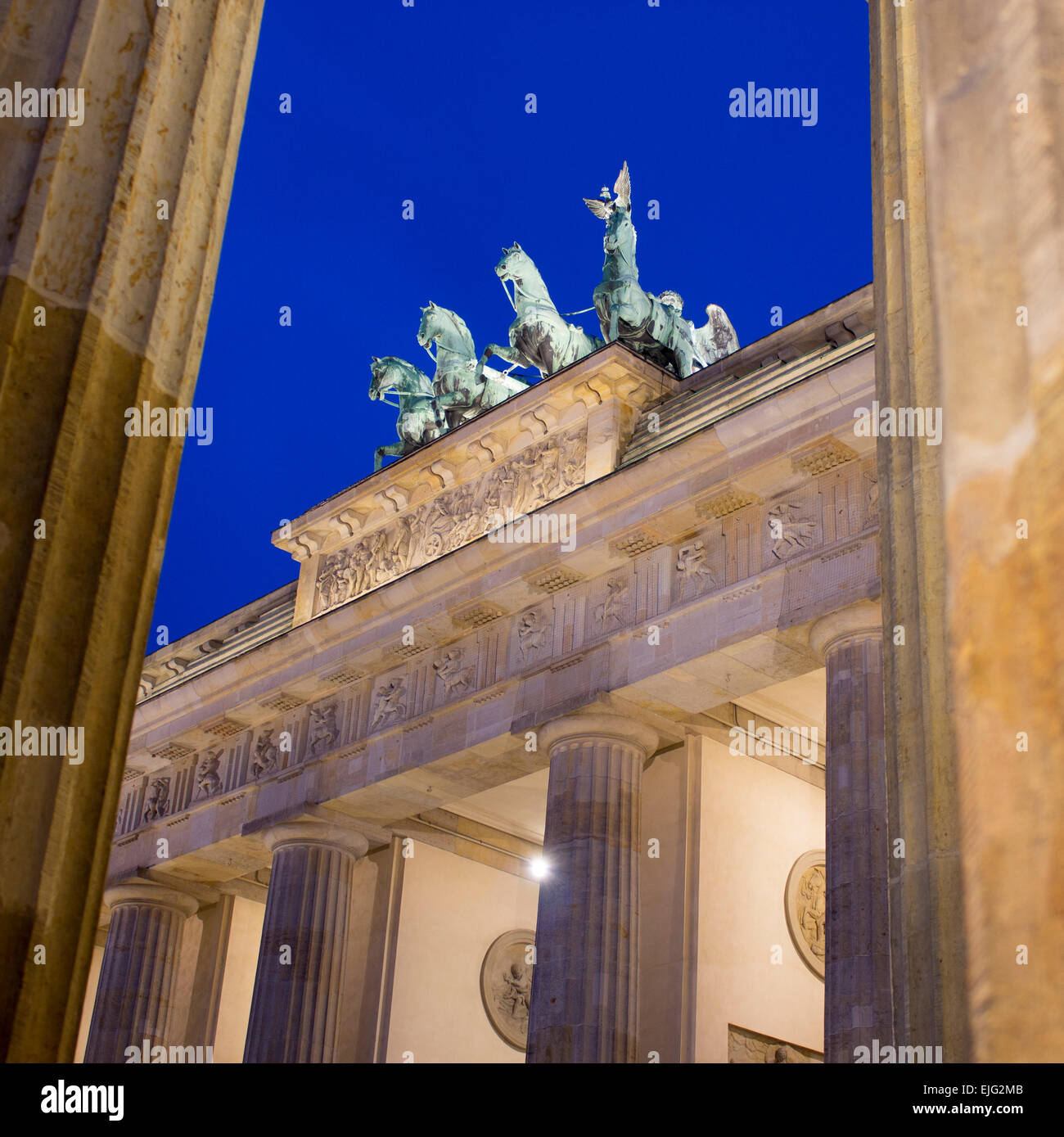 Brandenburg Gate Brandenburger Tor view through pillars at night dusk twilight Mitte Berlin Germany Stock Photo