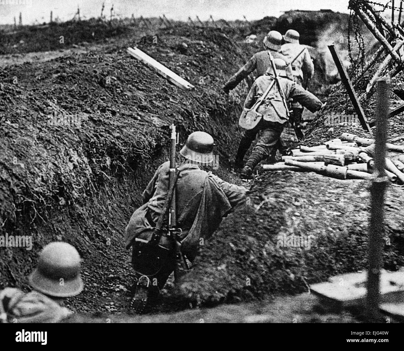 GERMAN STORMTROOPERS near Sedan in May 1917. Note pile of stock grenades at right which would be carried in he bag slung over the shoulder  of the soldier next to them. Stock Photo