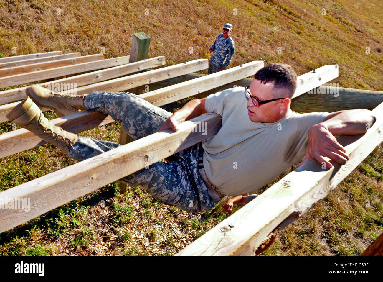 Sgt. James Dvorak weaves through a wooden ladder on West Camp Rapid’s obstacle course during the South Dakota National Guard’s state Noncommissioned Officer of the Year competition Oct. 1, 2011. Dvorak went on to win the competition, becoming the state’s NCO of the Year. SDNG photo by Spc. Julieanne Morse Stock Photo