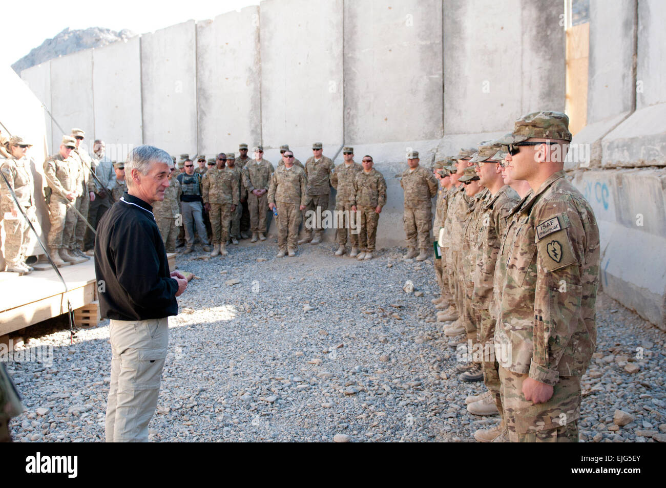 Secretary of the Army John McHugh speaks to &quot;Arctic Wolf&quot; Soldiers of the 1st Stryker Brigade Combat Team, 25th Infantry Division after presenting two Purple Heart medals, two Combat Infantryman Badges and five Combat Action Badges during a visit to Forward Operating Base Masum Ghar in Kandahar Province, Afghanistan, Dec. 14. Stock Photo