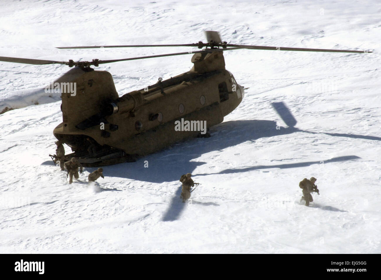 U.S. Soldiers from Alpha Company, 1st Platoon, Personnel Security Detail, 101st Airborne Division exit a CH-47 Chinook helicopter to provide security in Bagram, Afghanistan, Feb. 15, 2009.  Sgt. Prentice C. Martin-Bowen Stock Photo