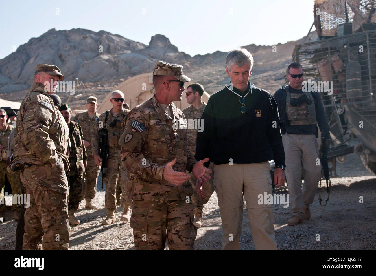 Secretary of the Army John McHugh talks with Col. Todd R. Wood, commander of 1st Stryker Brigade Combat Team, 25th Infantry Division, during a visit to Forward Operating Base Masum Ghar in Kandahar Province, Afghanistan, Dec. 14.  Spc. John G. Martinez Stock Photo