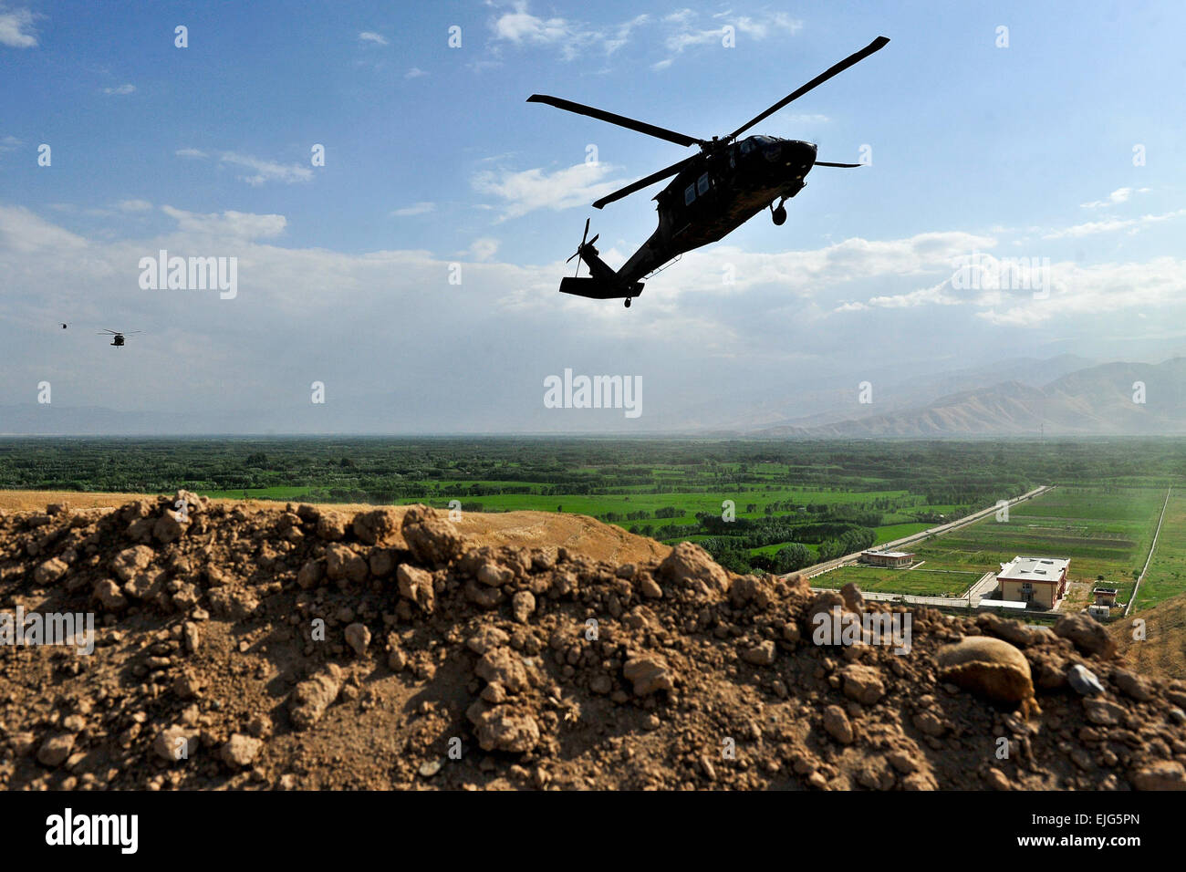 Three UH-60 Black Hawk helicopters land at an out post in Northerm Afghanistan, July 22nd, in the Samangan Province. U. S. Air Force  SSgt Bradley Lail Stock Photo