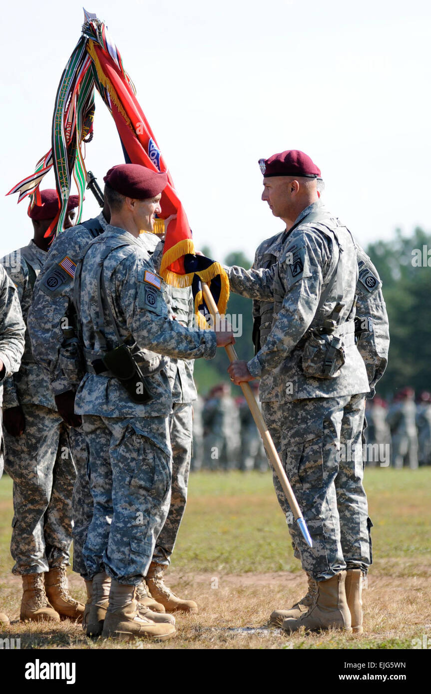 Lt. Gen. Joseph Anderson, right, commanding general, XVIII Airborne Corps, passes the 82nd Airborne Division colors to Brig. Gen. Richard D. Clarke, incoming Division commander, during the 82nd Abn. Div. change of command ceremony on Fort Bragg, N.C.’s Pike Field, Oct. 3, 2014. During the ceremony, Brig. Gen. Clarke assumed command of the 82nd from Maj. Gen. John W. Nicholson who is slated to take command of Allied Land Command, NATO, Izmir, Turkey.  Staff Sgt. Kissta DiGregorio, 82nd Airborne Division Stock Photo