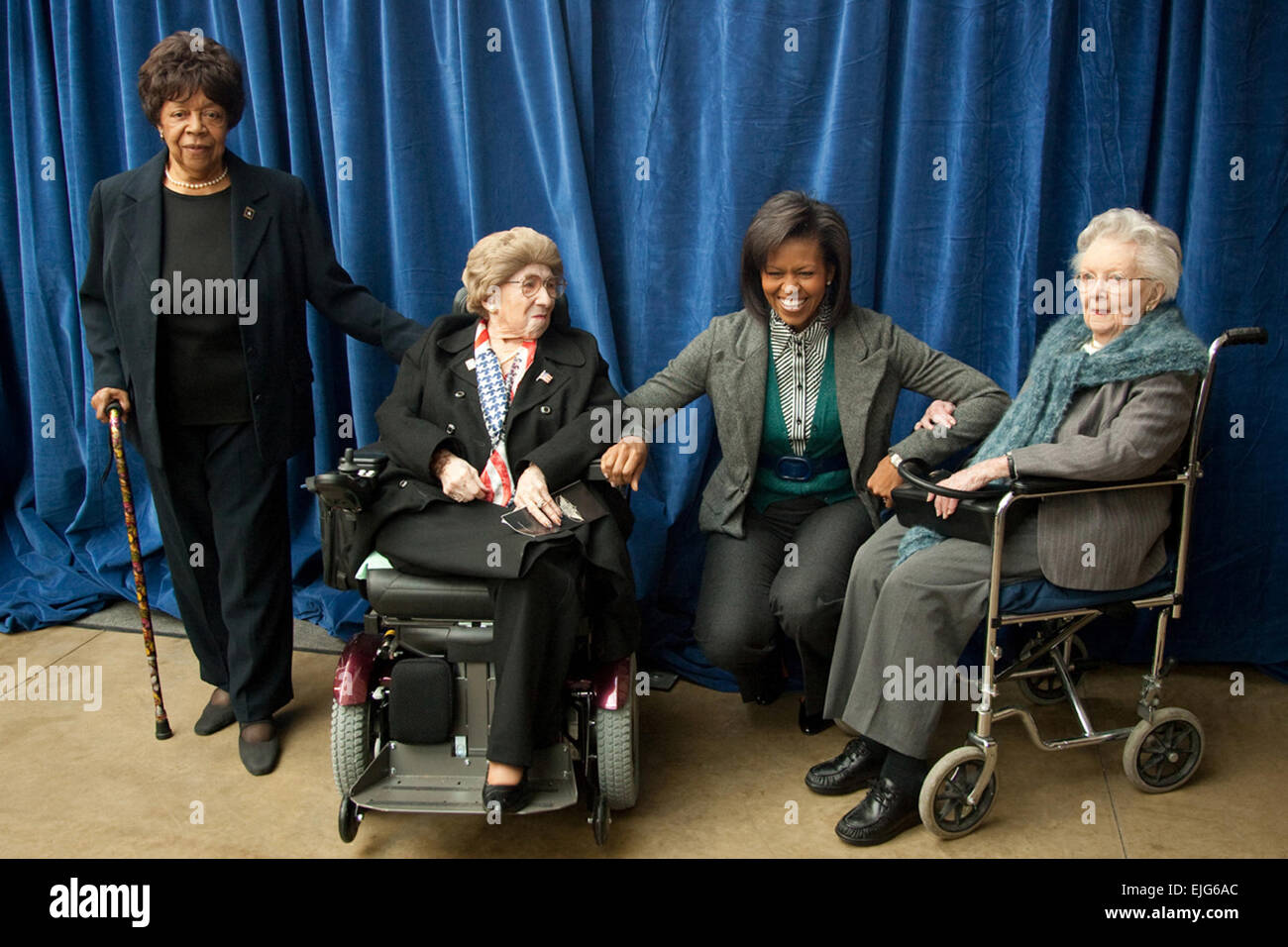 From left to right, Mary Ragland and Alyce Dixon, both company clerks in the 6888th Central Postal Directory Battalion during World War II; first lady Michelle Obama; and Esther Corcoran, one of the first women to achieve the rank of Army lieutenant colonel, pose for a photo during a March 3, 2009, event honoring Women's History Month and military families at Arlington National Cemetery's Women in Military Service for America Memorial Center in Arlington, Va.   White House photo by Joyce N. Boghosian  Women in the U.S. Army  /women Stock Photo