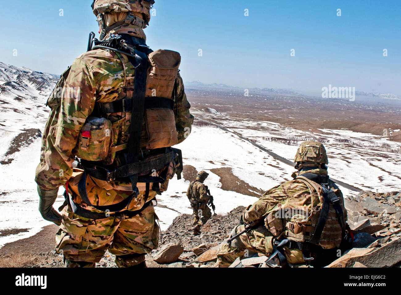 Spc. Richard Madrid left and Command Sgt. Maj. Samuel Murphy of 3rd Stryker Brigade Combat Team, 2nd Infantry Division, take in the view of the horizon at a checkpoint near Daab Pass in Shinkay district, Afghanistan, Feb. 25. Stock Photo