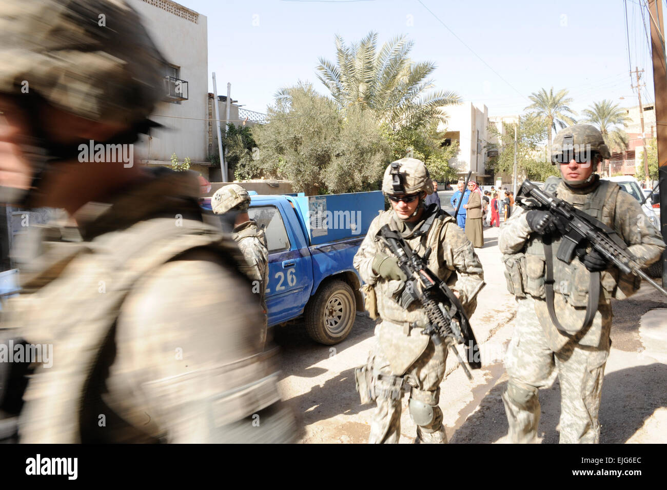U.S. Soldiers of Alpha Battery, 3rd Battalion, 29th Field Artillery Regiment, 3rd Brigade, 4th Infantry Division, search homes for illegal weapons in the city of Baghdad, Iraq on Feb. 1, 2009. They are trying to find the unlawful weapons to try to make the city a safer place to live. Stock Photo