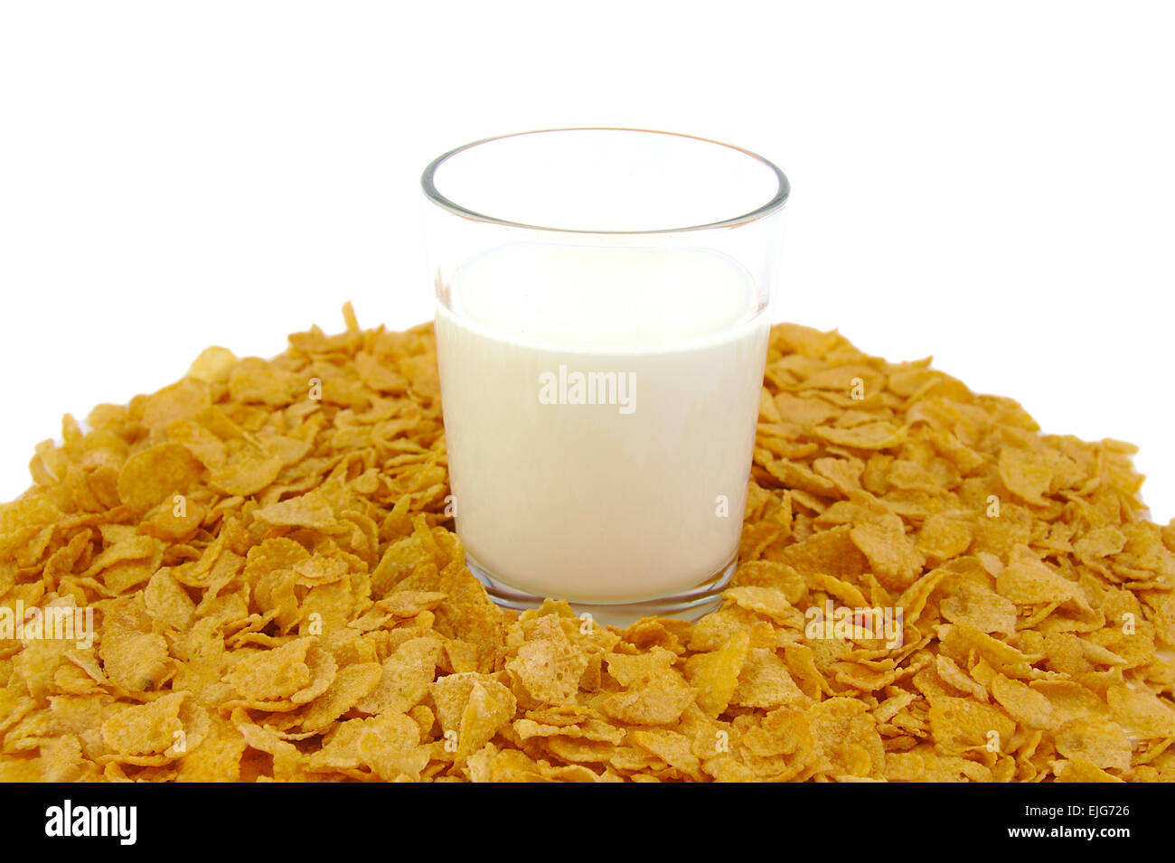 Glass of milk and corn flake cereals on white background Stock Photo ...