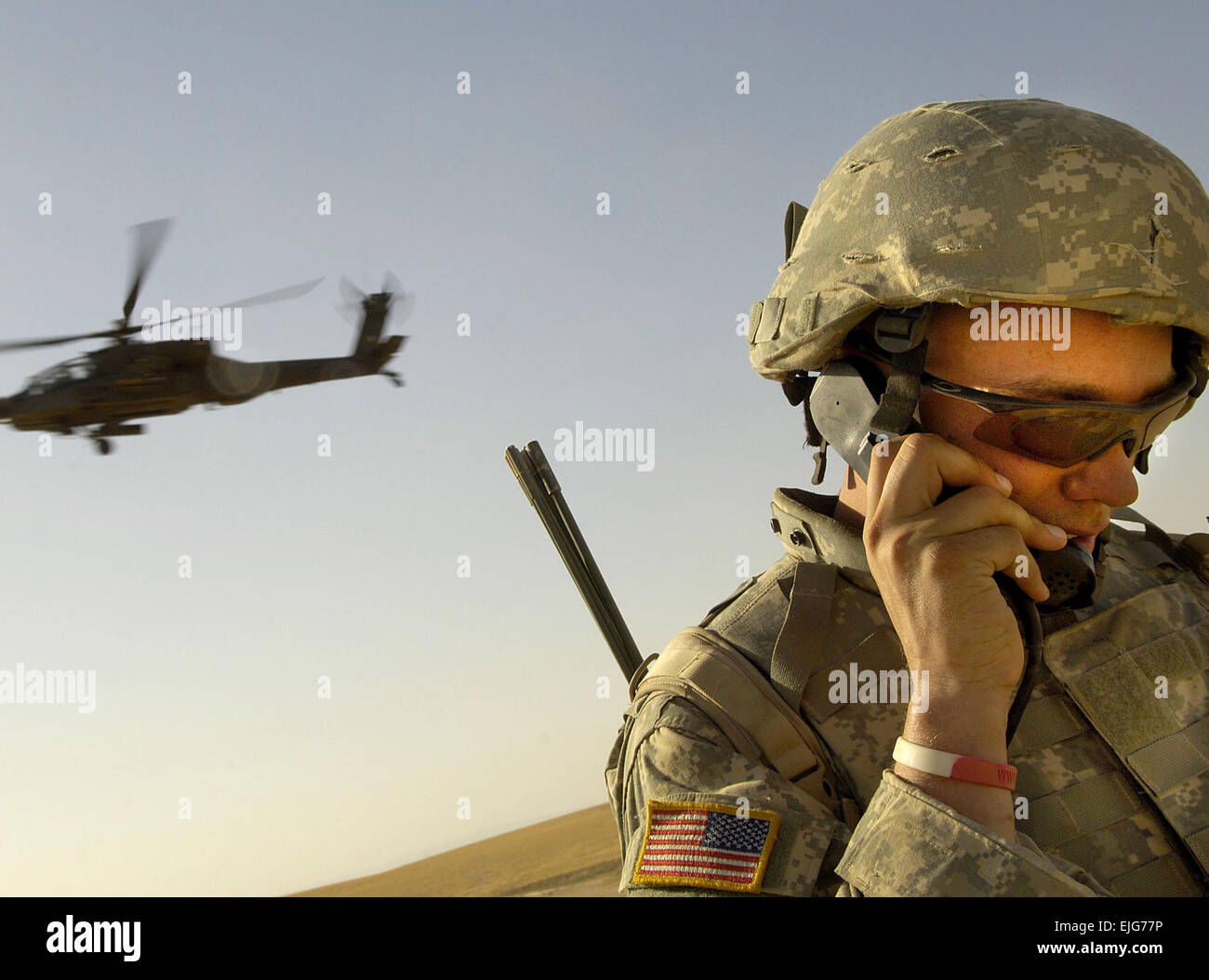 2nd Lt. Zack Zilai, B Company, 4-23 Infantry Regiment, 172nd Stryker Brigade Combat Team, maintains radio contact with Apache helicopters during an aerial traffic control point mission near Tall Afar, Iraq, on June 5, 2006.  Staff Sgt. Jacob N. Bailey.      . Stock Photo