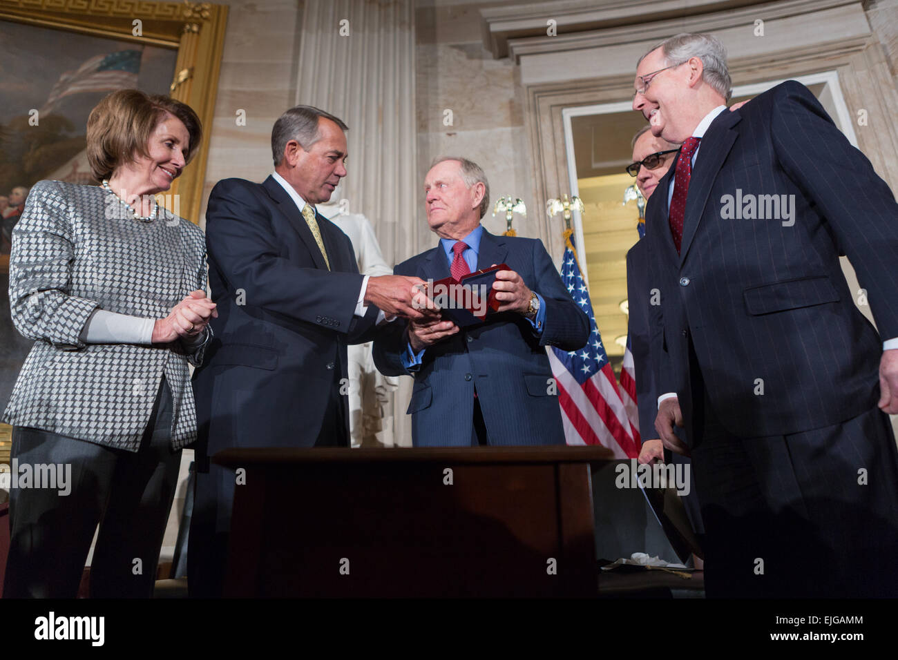 US Congressional leaders present a Congressional Gold Medal to golfer Jack Nicklaus for his promotion of excellence, good sportsmanship, and philanthropy during a ceremony March 24, 2015 in Washington, DC. From left to right: House Minority Leader Nancy Pelosi, Speaker John Boehner, Jack Nicklaus, Senate Minority Leader Harry Reid and Senate Majority Leader Mitch McConnell. Stock Photo