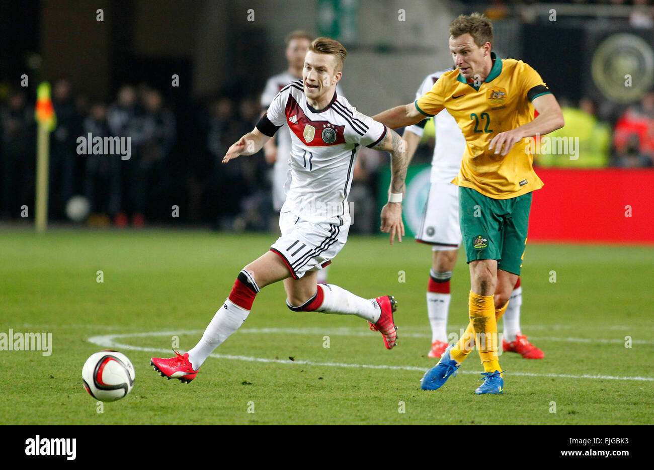 Germany's Marco Reus (Borussia Dortmund) (L) against Alex Wilkinson (Jeonbuk Hyundai Motors) during the friendly match between Germany and Australia, Fritz-Walter-Stadion in Kaiserslautern on March 25., 2015. Stock Photo