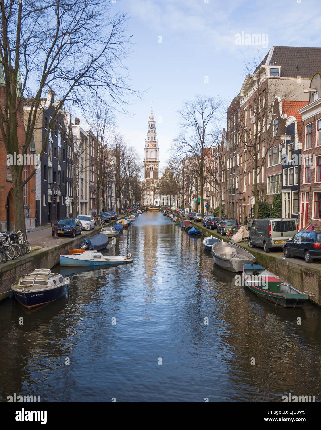 View along Groenbugrwal canal towards the tower of Zuiderkerk ('South Church') (1603-1611), Amsterdam, Netherlands. Stock Photo