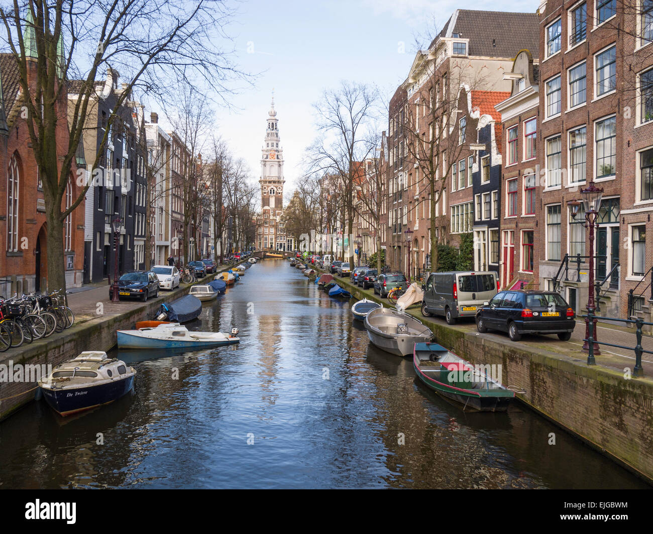 View along Groenburgwal canal towards the tower of Zuiderkerk ('South Church') (1603-1611), Amsterdam, Netherlands. Stock Photo