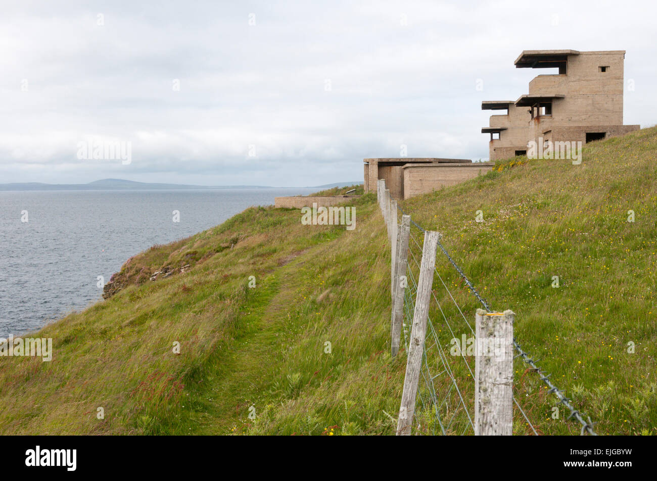 Command posts positioned behind 6-pounder gun emplacements overlooking the Sound of Hoxa at the entrance to Scapa Flow. Stock Photo