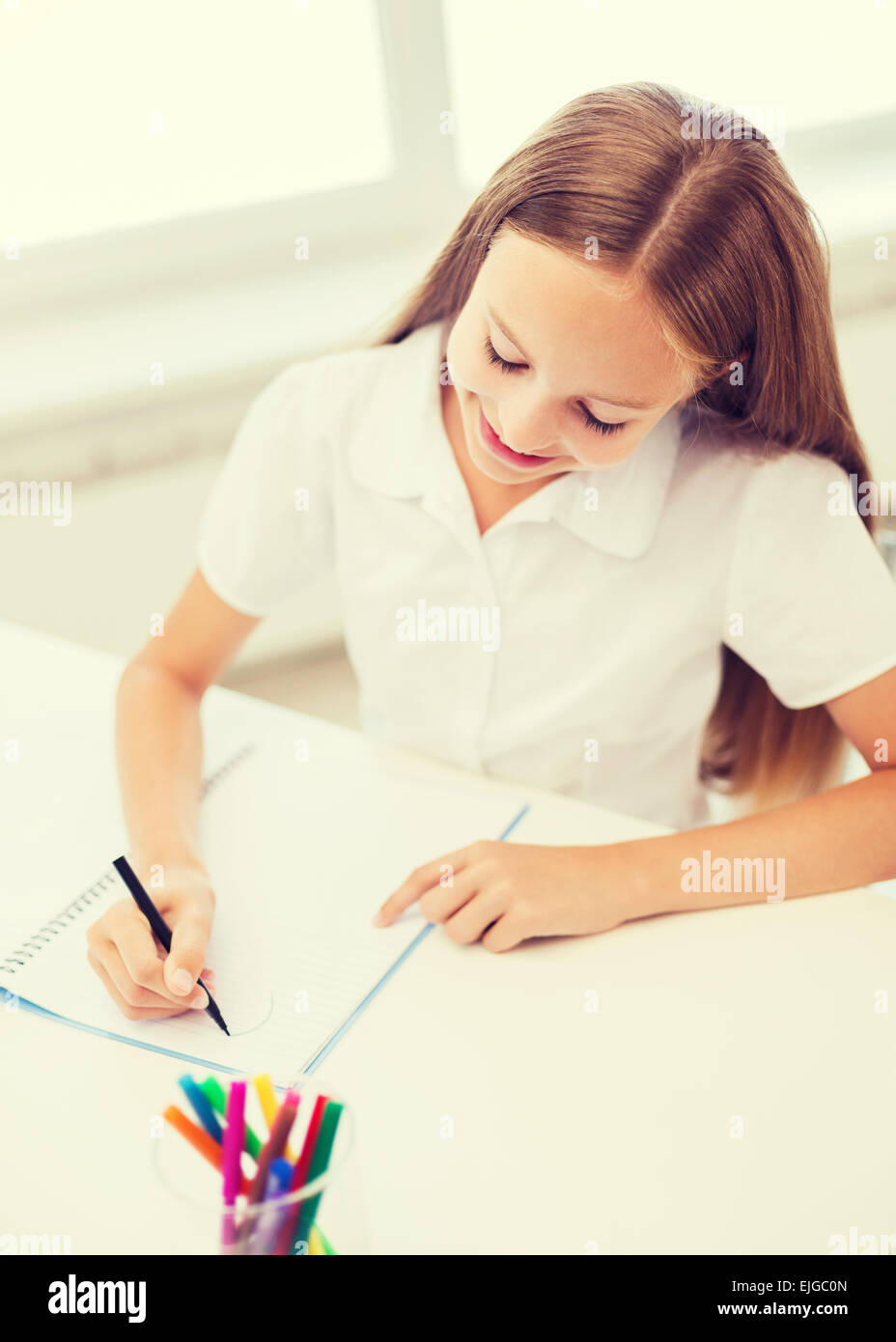little student girl drawing at school Stock Photo - Alamy