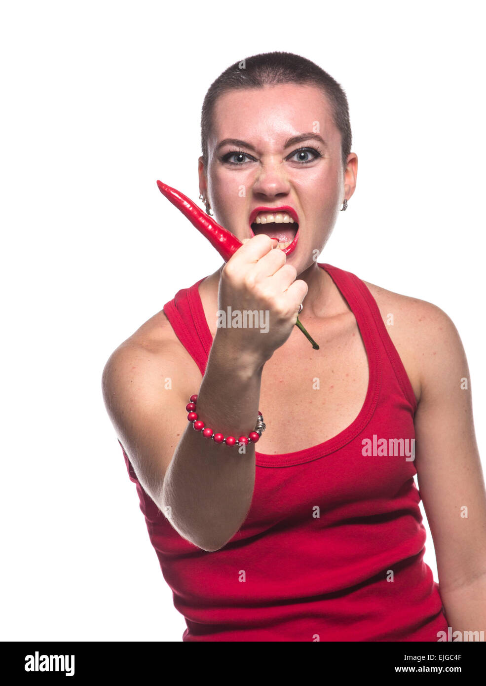 Aggressive Woman with chili pepper on white background Stock Photo