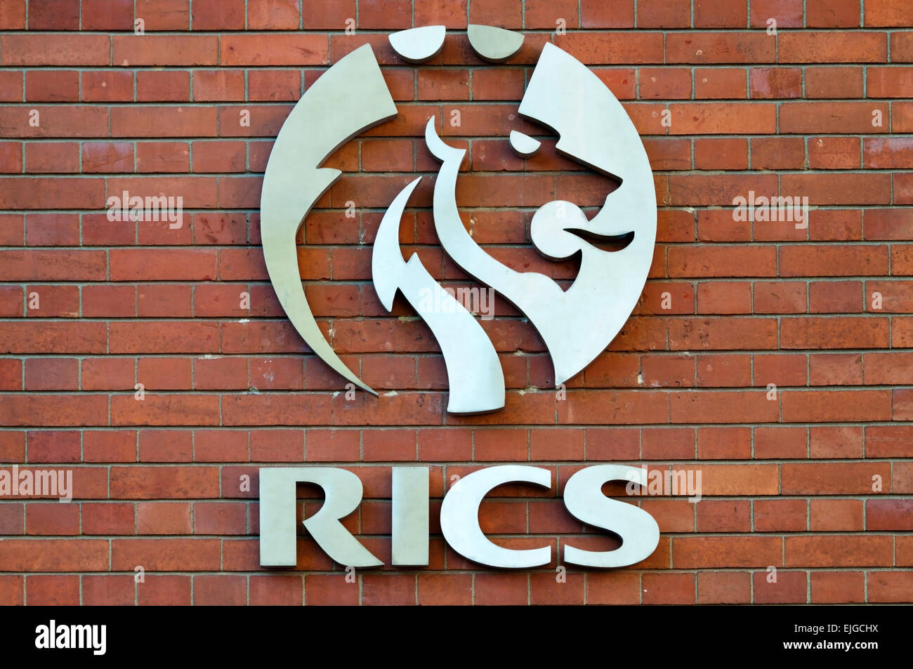 Symbol of the RICS, Royal Institute of Chartered Surveyors, on their headquarters building in central London. Stock Photo