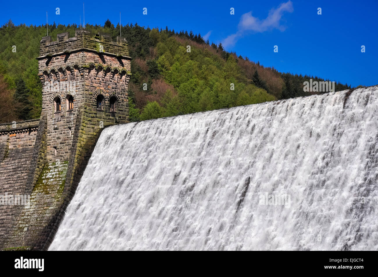 Water cascading down Derwent dam in the Peak District, Derbyshire. A sunny spring day. Stock Photo