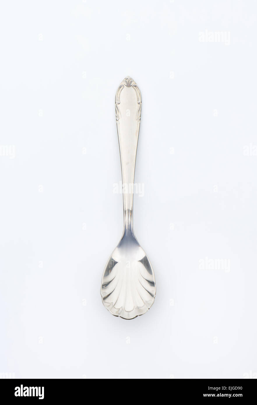 Cheese spoon with finely decorated cup and handle Stock Photo