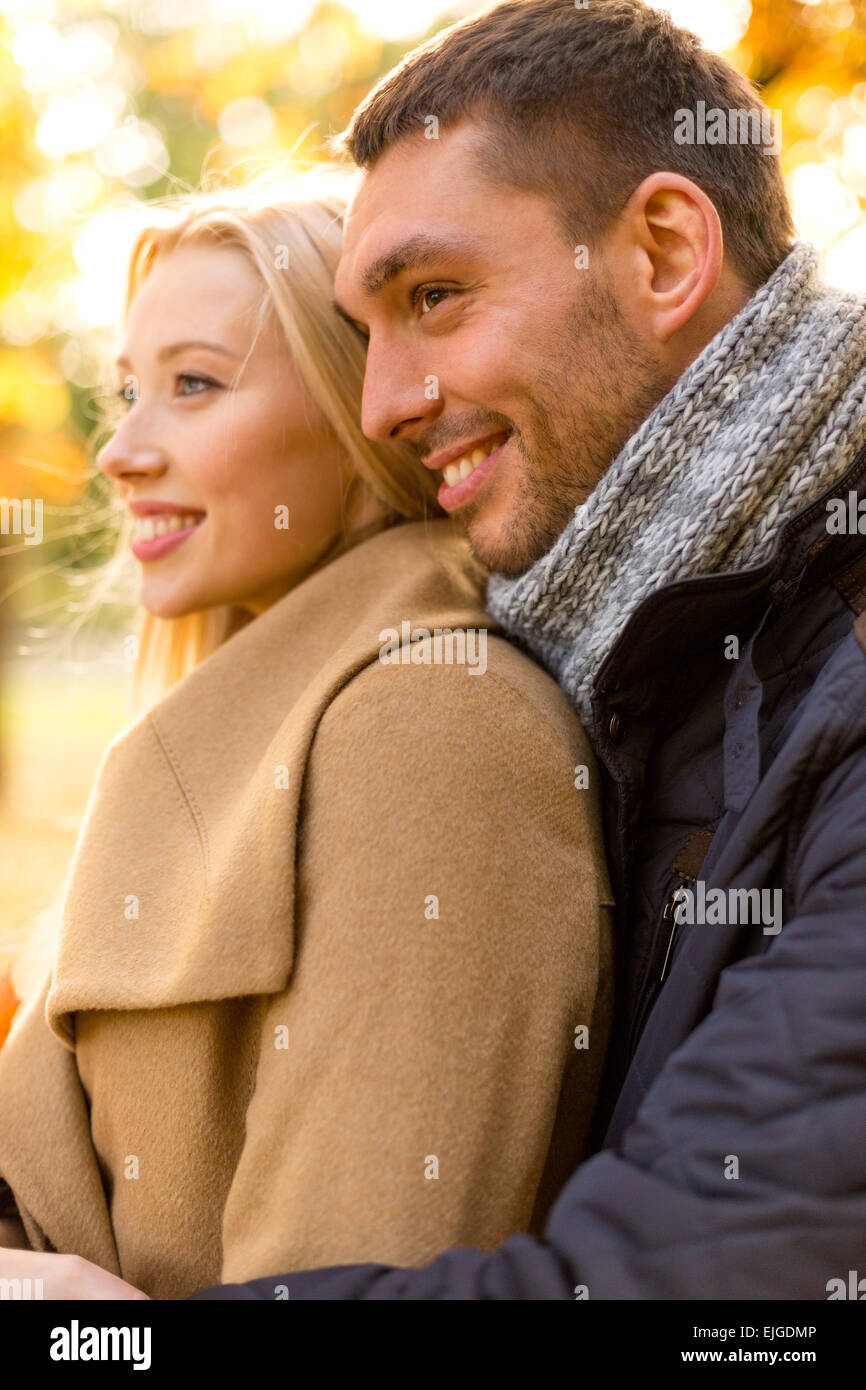 smiling couple hugging in autumn park Stock Photo - Alamy