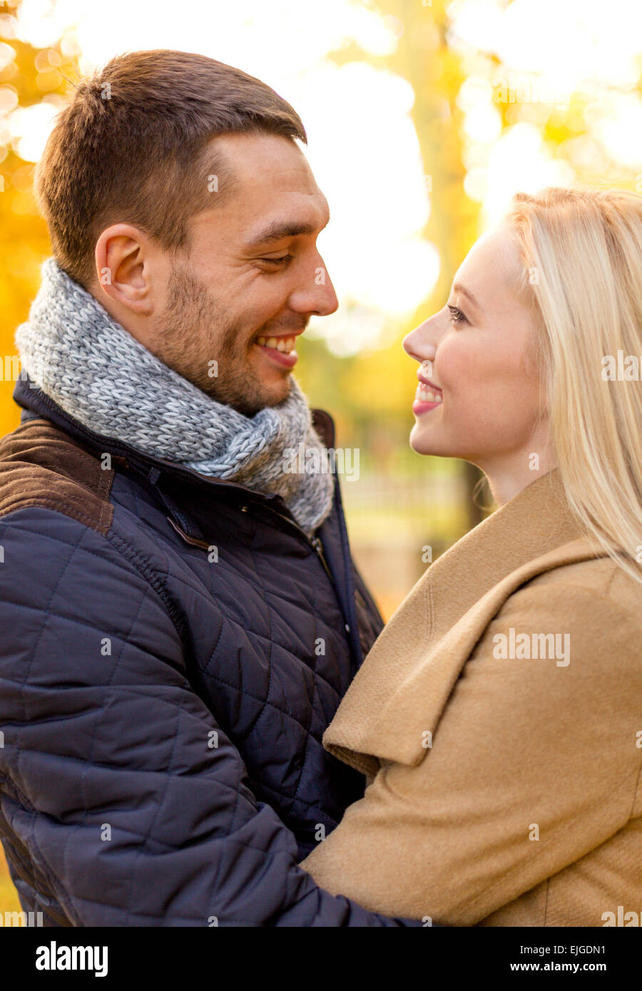 smiling couple hugging in autumn park Stock Photo - Alamy