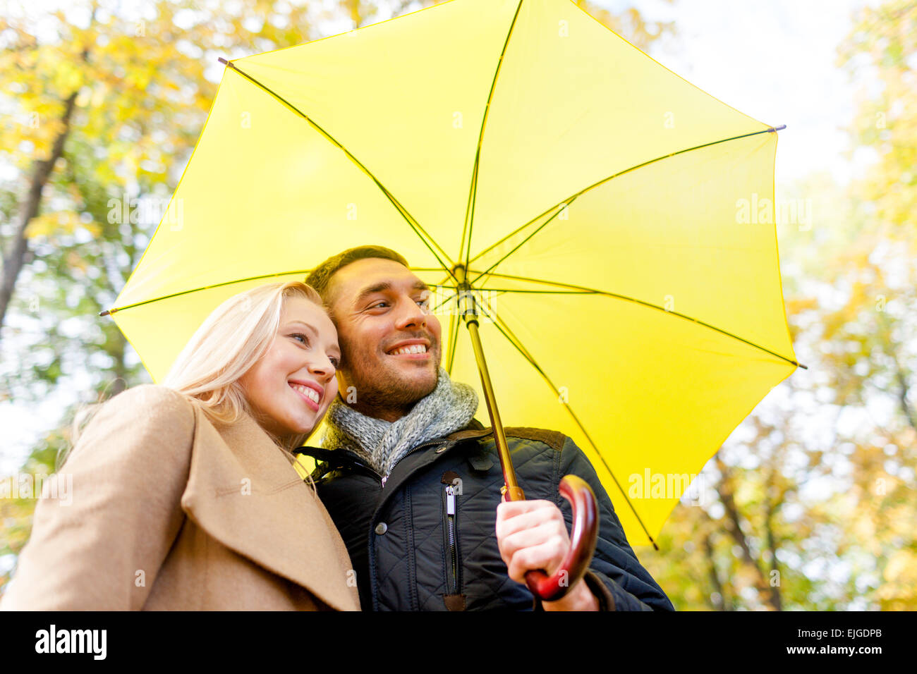 smiling couple hugging in autumn park Stock Photo - Alamy