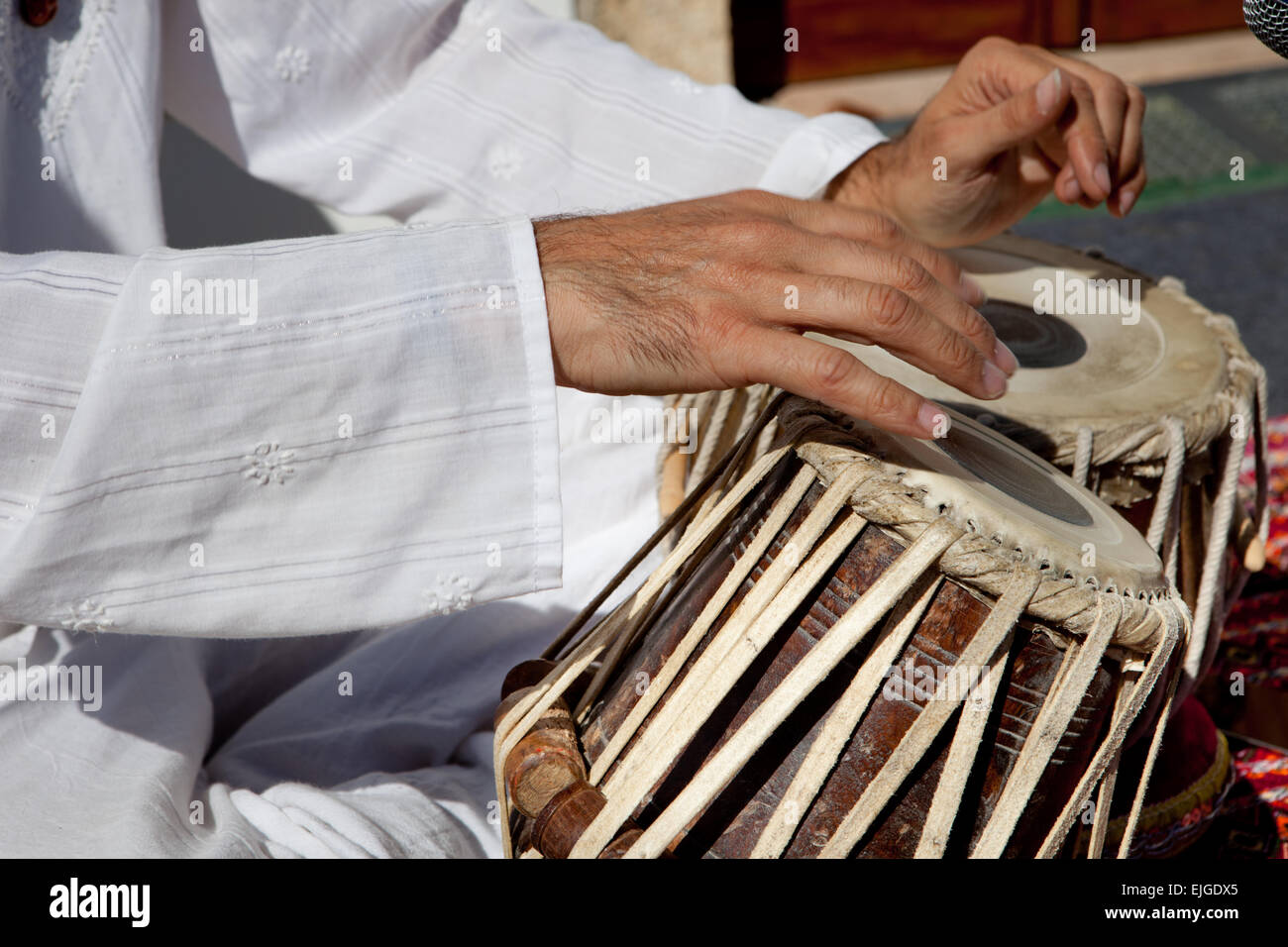 Man playing on traditional indian tabla drums. Closeup view Stock Photo