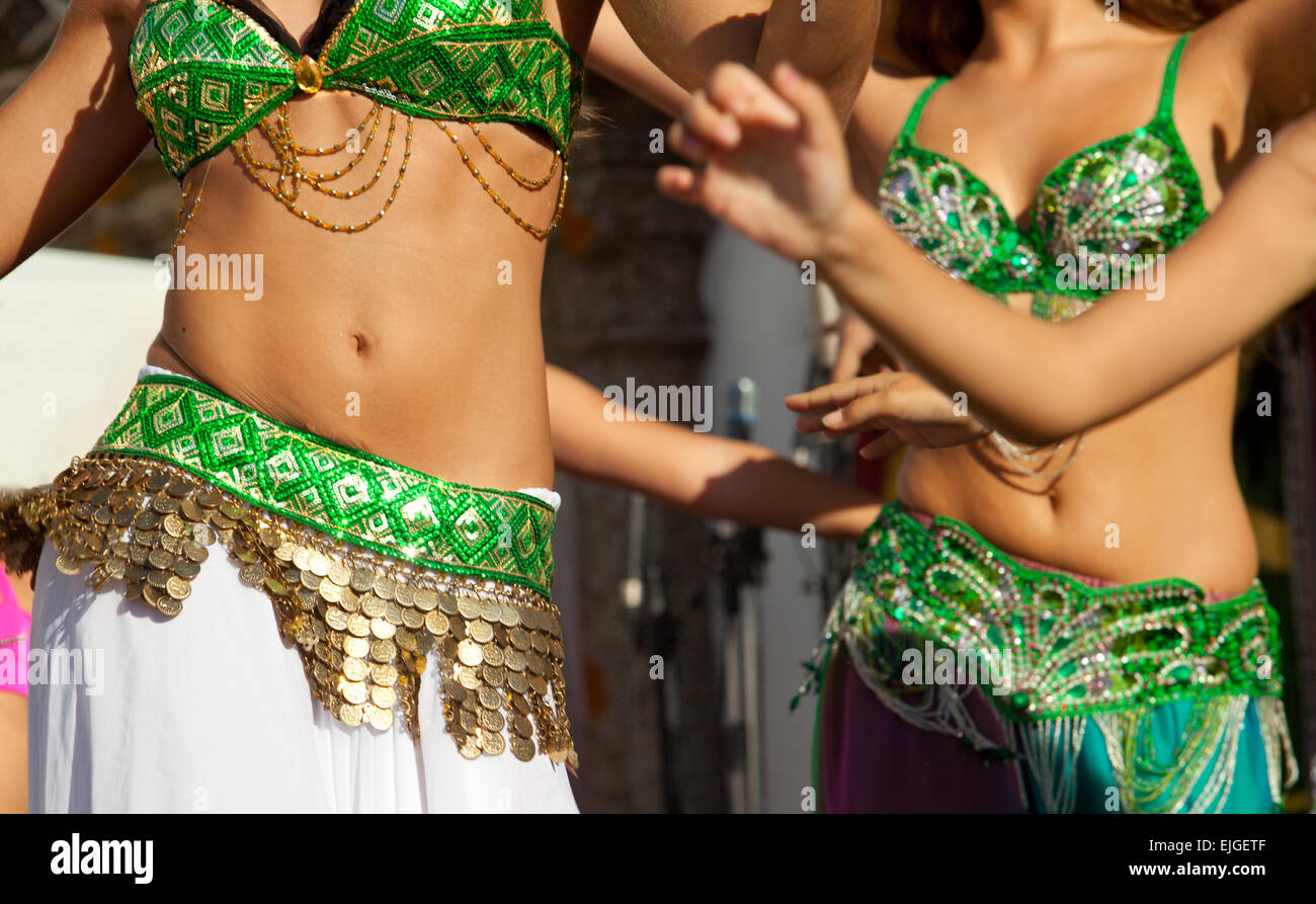 Belly dancers detail dancing with arabic music street band at the Almossasa Festival, Marvao, Portugal Stock Photo