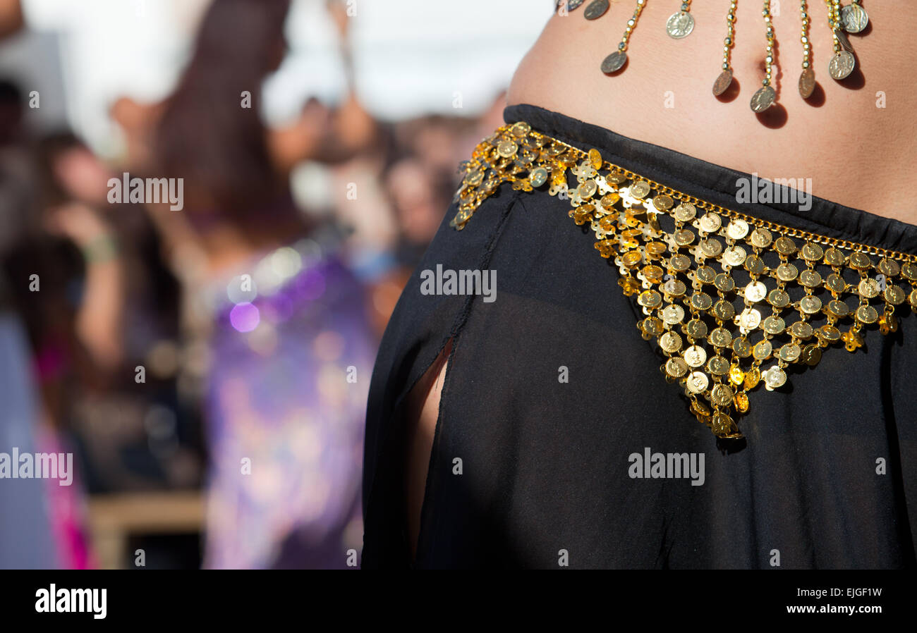 Belly dancers detail dancing with arabic music street band at the Almossasa Festival, Marvao, Portugal Stock Photo