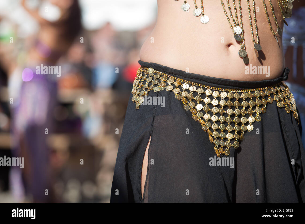 Belly dancers detail dancing with arabic music street band at the Almossasa Festival, Marvao, Portugal Stock Photo