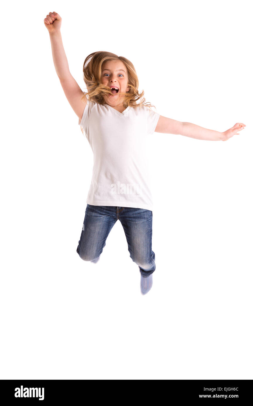 blond kid girl indented jumping high wind on hair denim jeans at white background Stock Photo