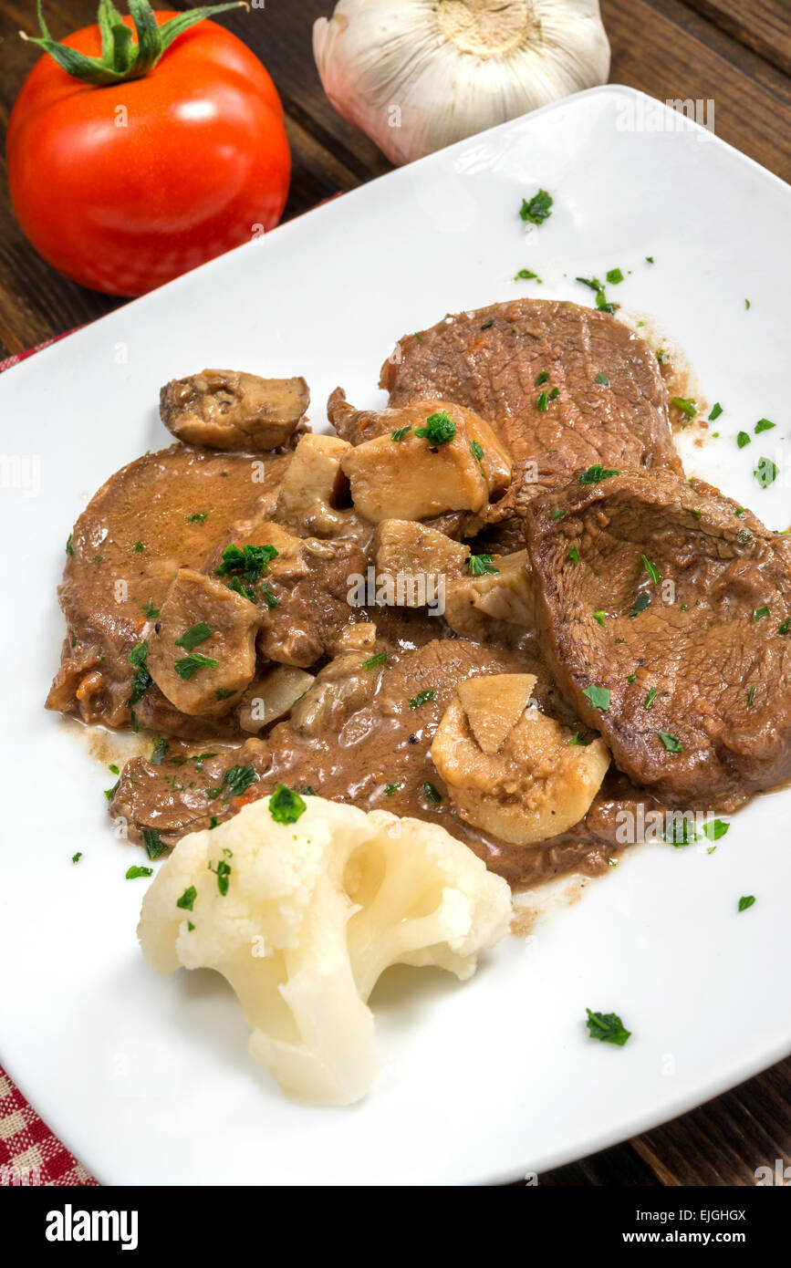 scallops of veal with porcini mushroom sauce and parsley Stock Photo