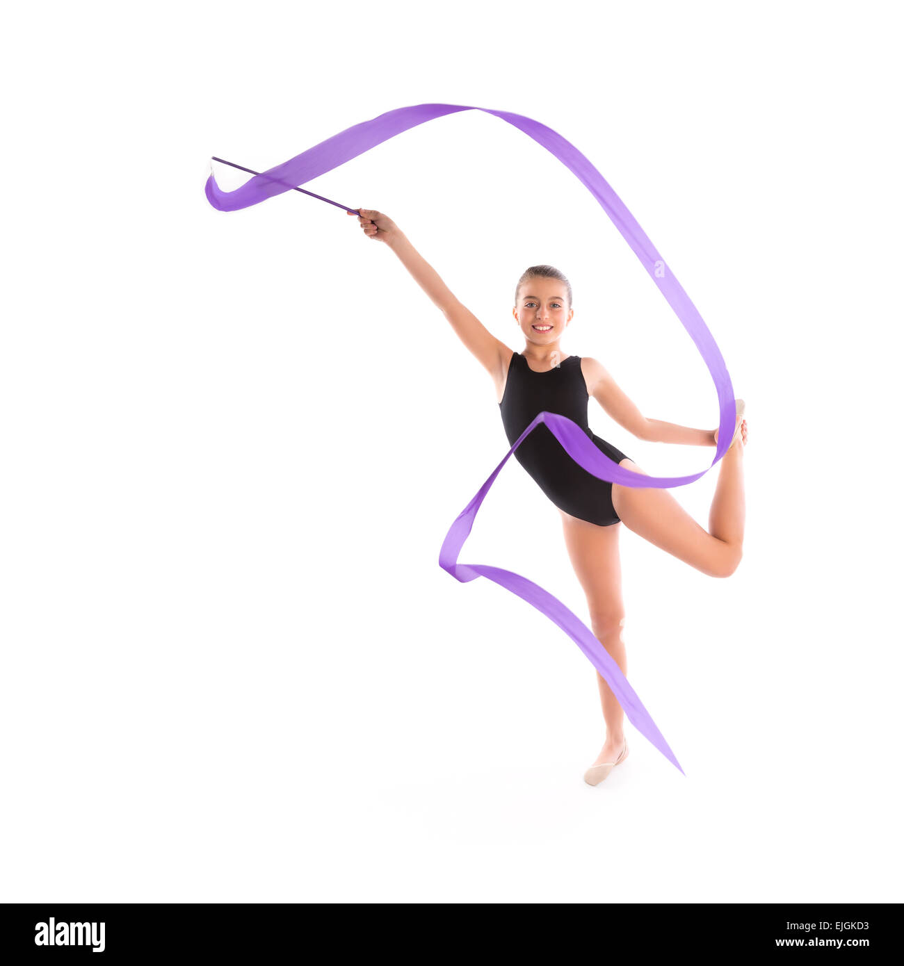 Kid girl ribbon rhythmic gymnastics exercise on white background Stock Photo