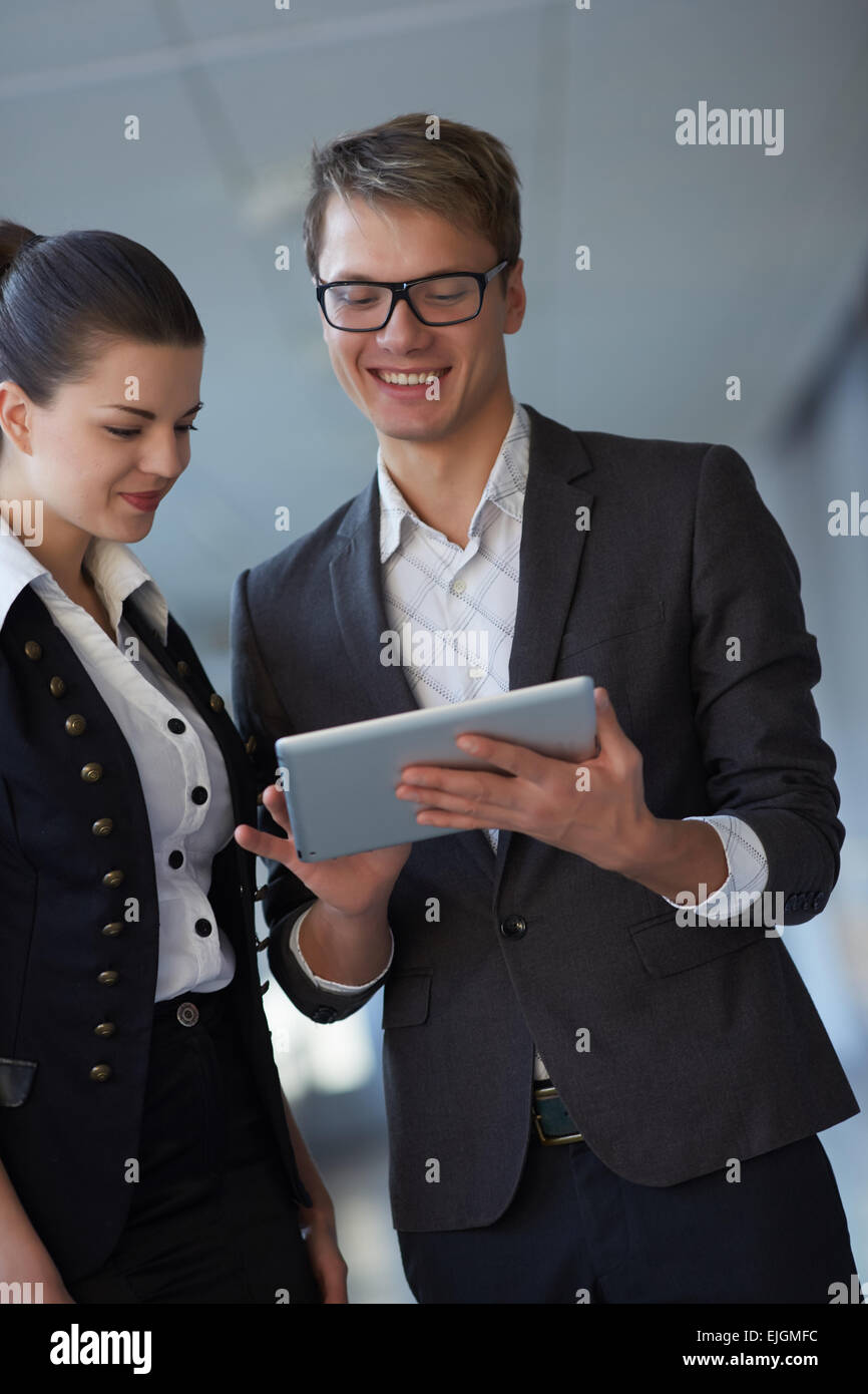 Young business woman and businessman in the hallway Stock Photo - Alamy