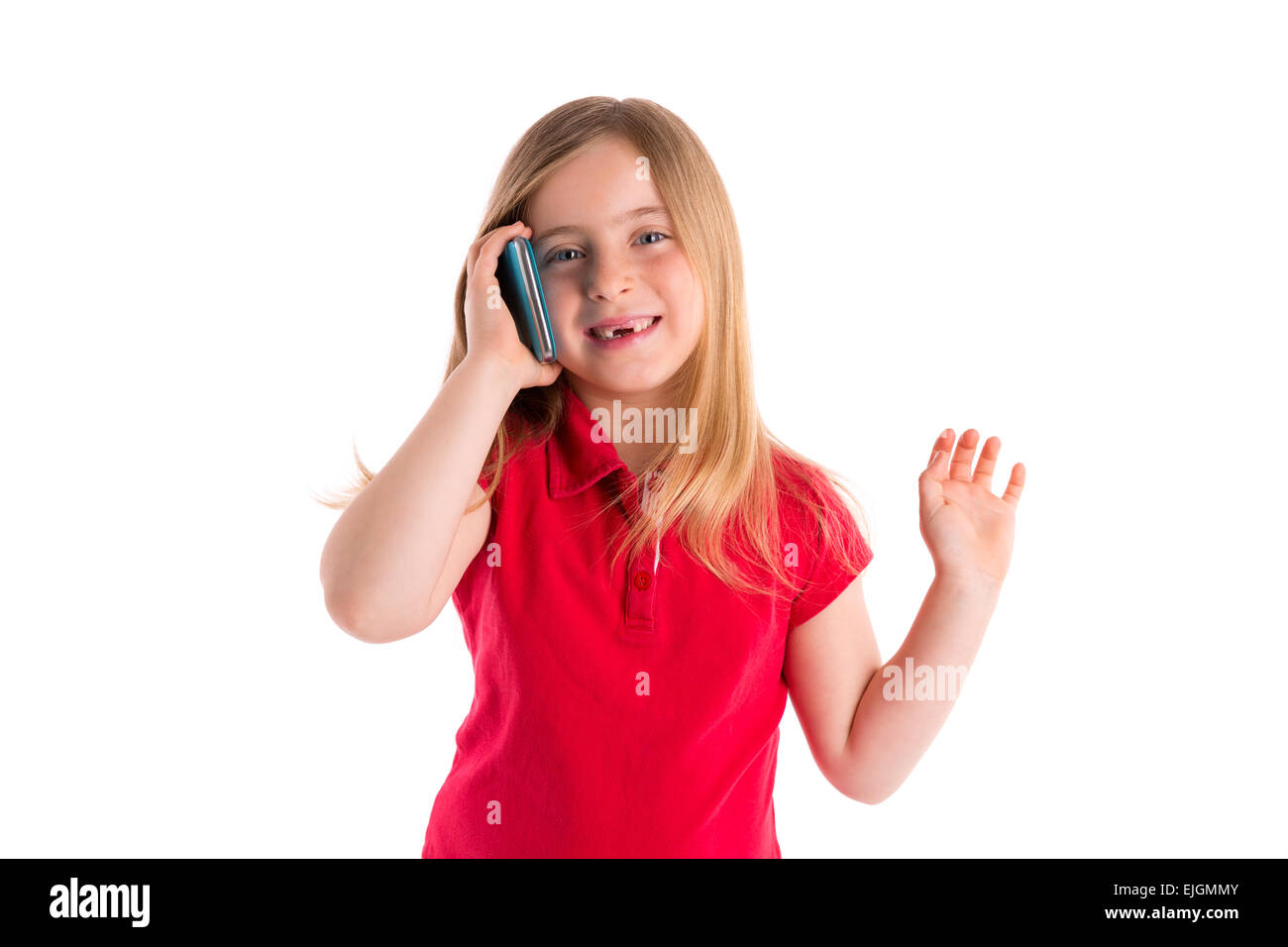 blond indented kid girl smiling talking smartphone phone on white background Stock Photo