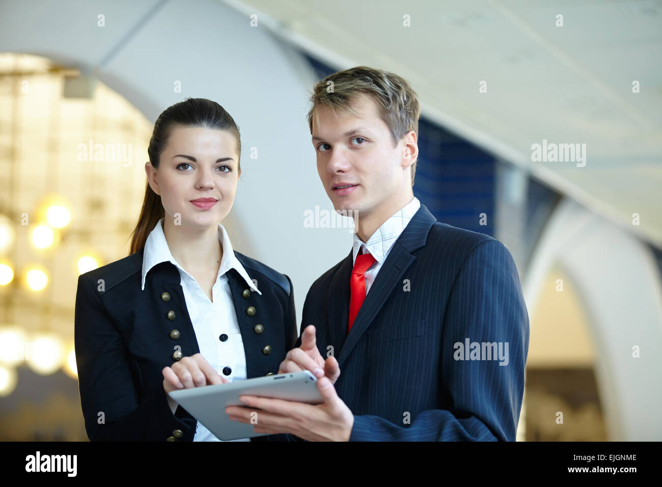 Young business woman and businessman in the hallway Stock Photo - Alamy
