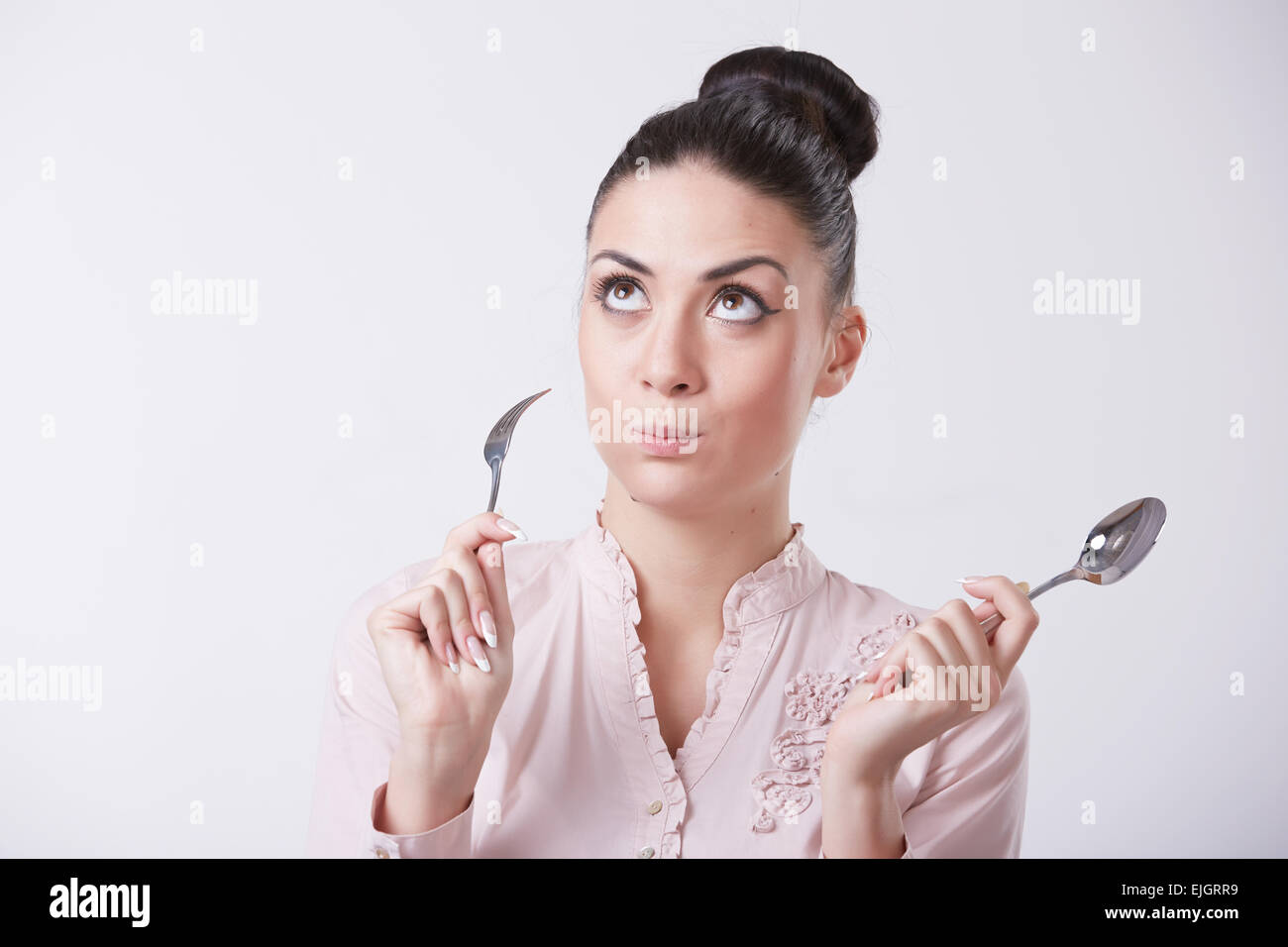 woman with spoon and fork Stock Photo Alamy