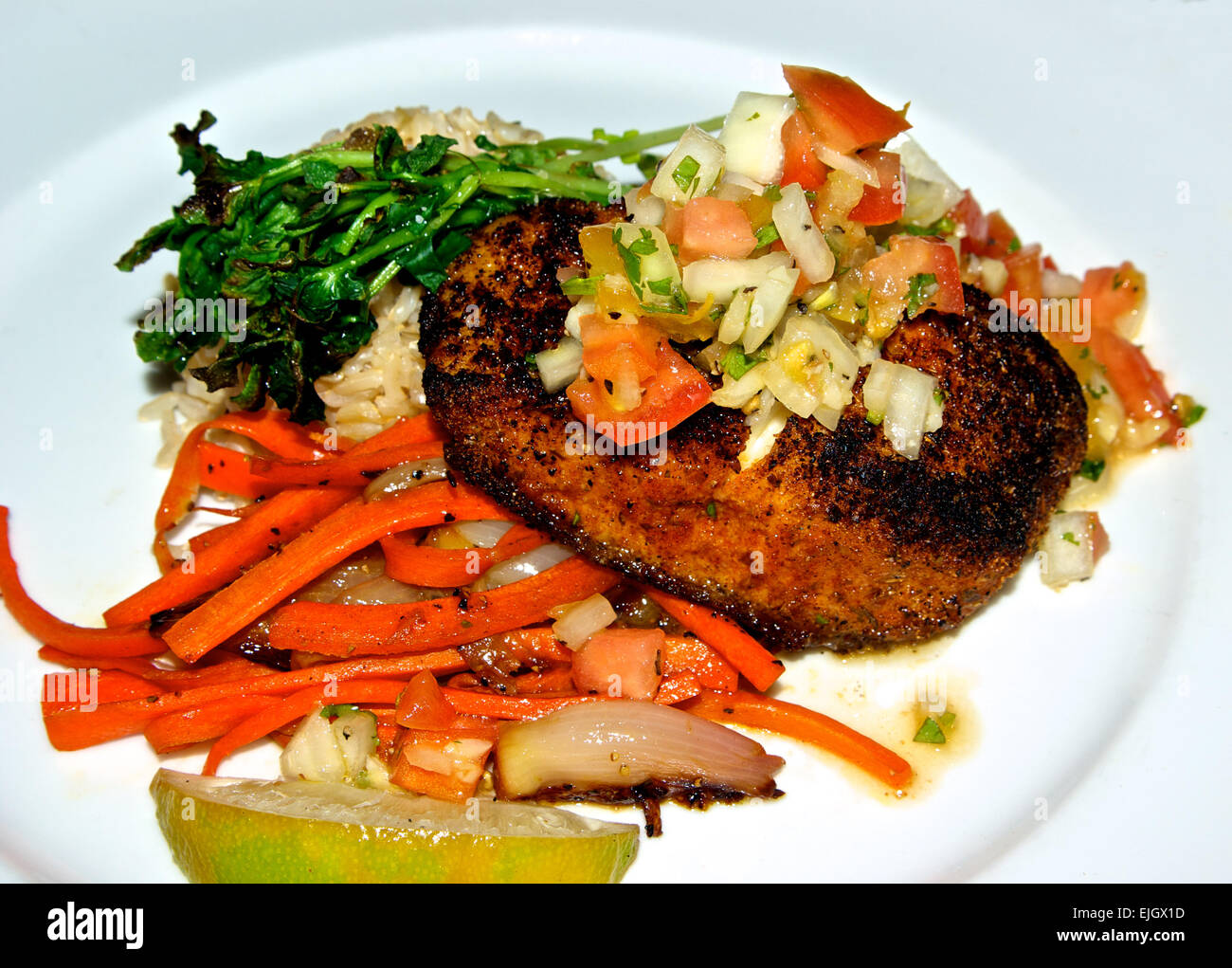 Seafood dinner entree Cajun spiced baked halibut filet salsa brown rice