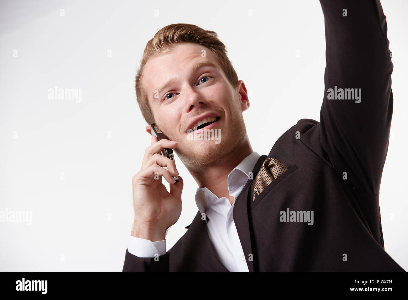 businessman in glasses with a telephone waving Stock Photo